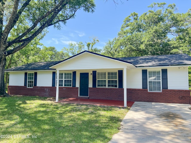 ranch-style house with a porch and a front yard