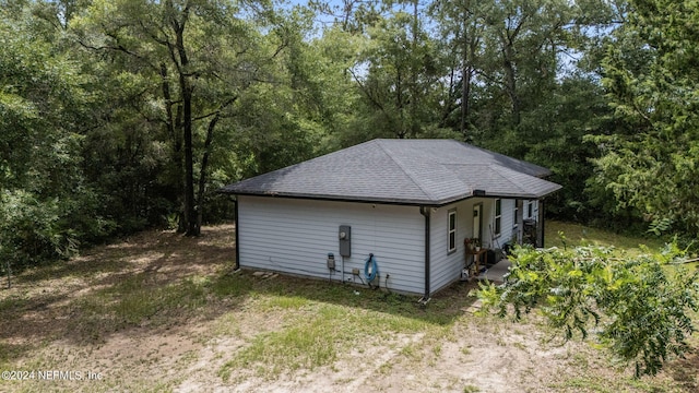 view of outbuilding with a view of trees