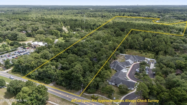 bird's eye view featuring a view of trees