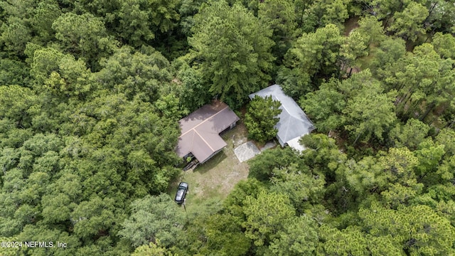 aerial view with a wooded view