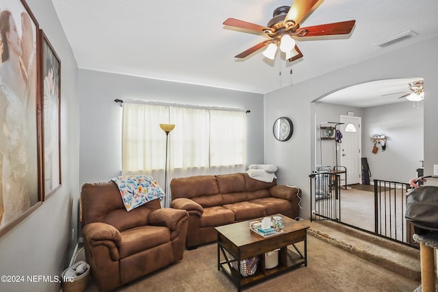 living room with carpet and ceiling fan