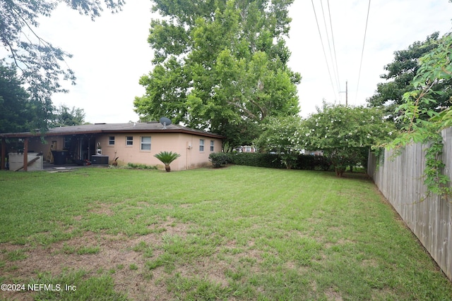 view of yard with central AC unit