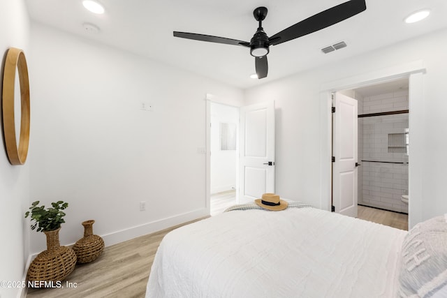 bedroom featuring ensuite bathroom, ceiling fan, and light hardwood / wood-style flooring