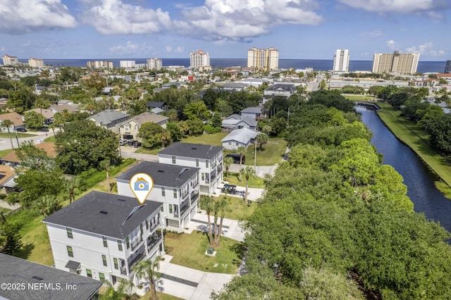 birds eye view of property with a water view