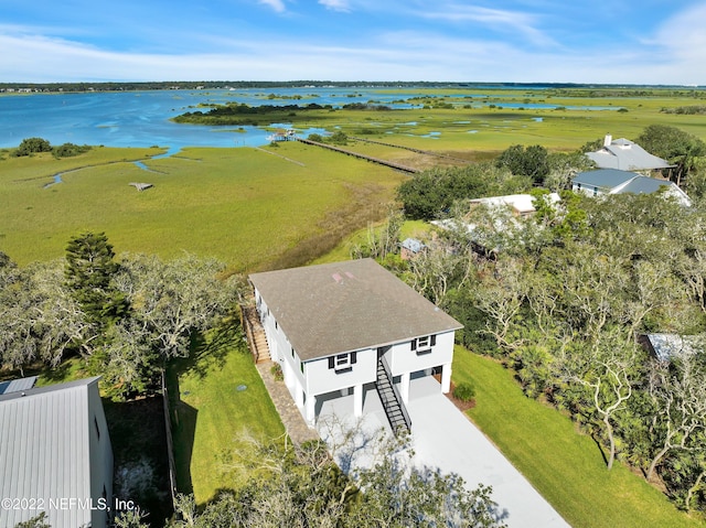 birds eye view of property featuring a water view and a rural view