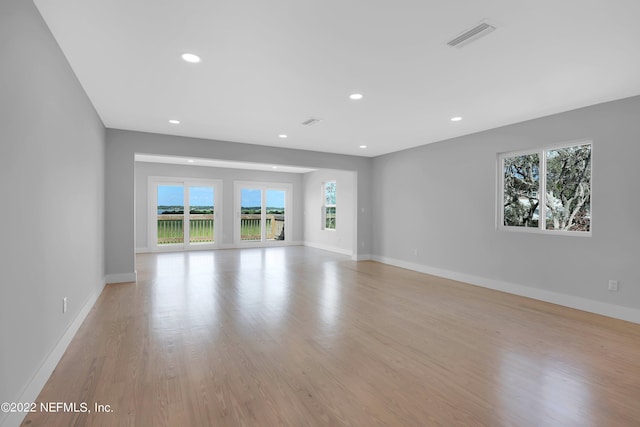 unfurnished living room featuring light hardwood / wood-style flooring