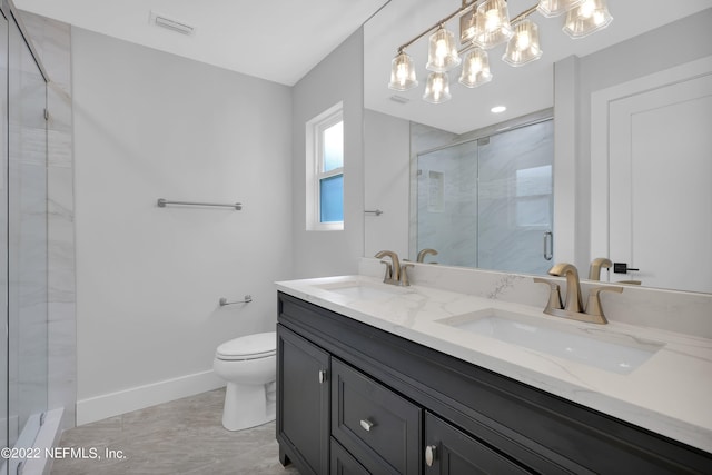 bathroom featuring toilet, walk in shower, and vanity