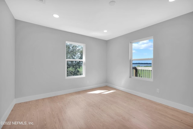 unfurnished room featuring light wood-type flooring