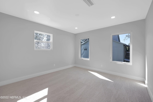 carpeted empty room featuring a healthy amount of sunlight