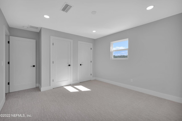 unfurnished bedroom with light carpet