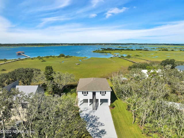 birds eye view of property with a rural view and a water view