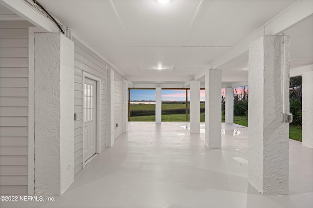 view of garage at dusk