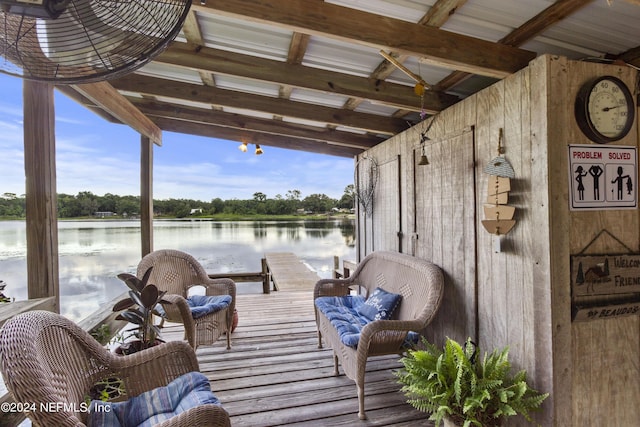 exterior space with a dock and a water view