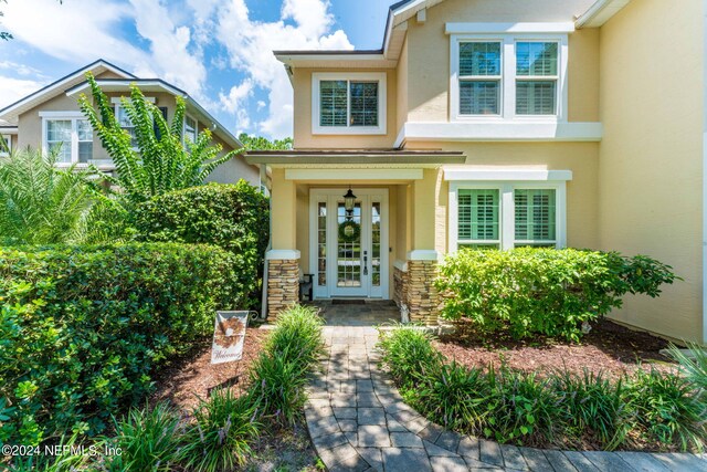 property entrance featuring french doors