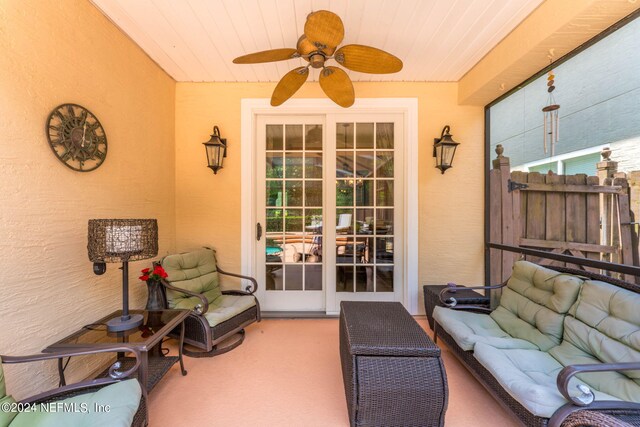 exterior space with outdoor lounge area and ceiling fan