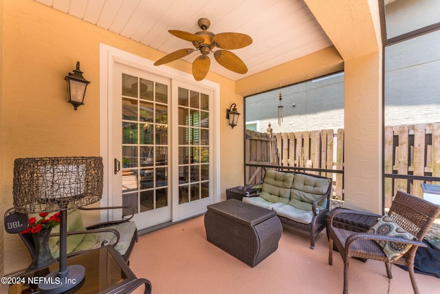 view of patio / terrace with an outdoor living space and ceiling fan