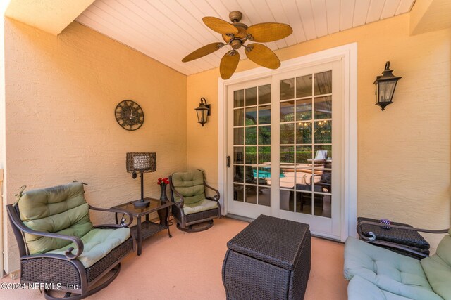 view of patio featuring ceiling fan