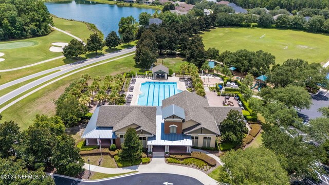 birds eye view of property with a water view