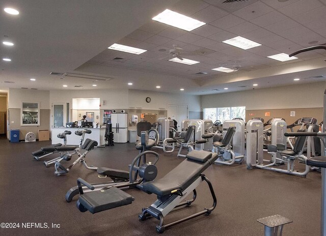 exercise room featuring a paneled ceiling