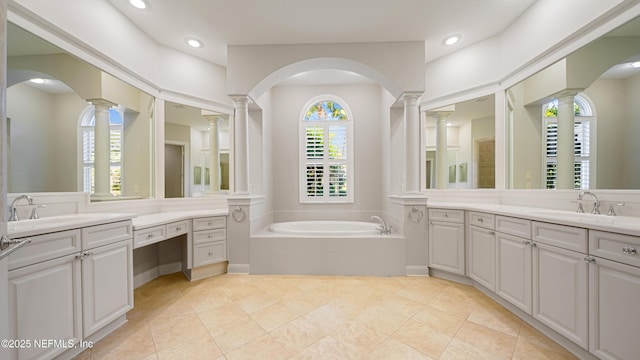 bathroom with vanity, tile patterned floors, and a bathing tub