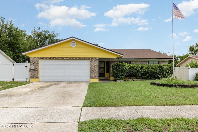 ranch-style house with a garage and a front yard