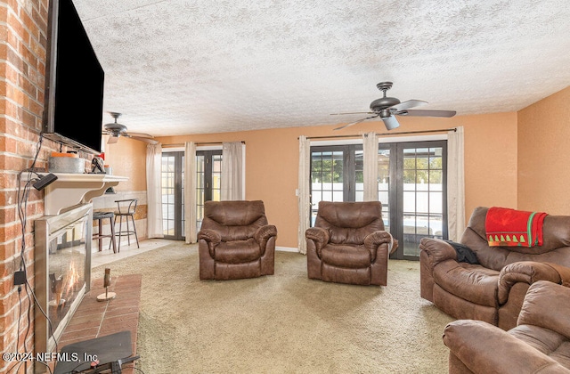 living room featuring carpet floors, brick wall, and ceiling fan