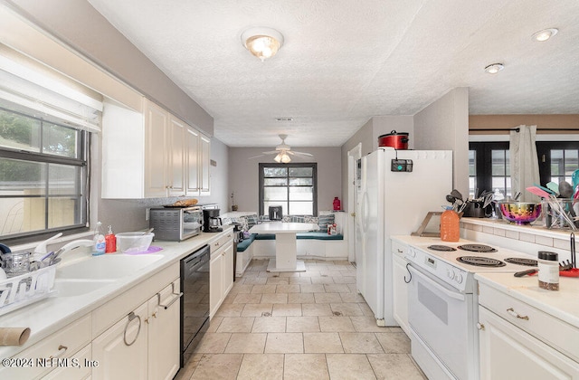 kitchen with white cabinets, white appliances, light tile patterned floors, and ceiling fan