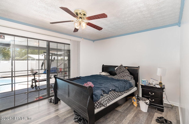 bedroom with ceiling fan, crown molding, a textured ceiling, and hardwood / wood-style flooring