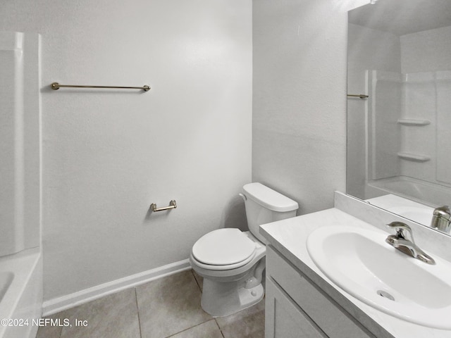 bathroom featuring tile patterned floors, vanity, and toilet