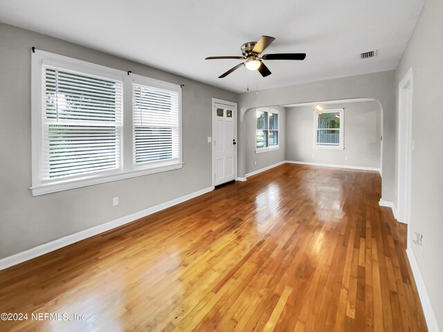 unfurnished living room with light hardwood / wood-style floors and ceiling fan