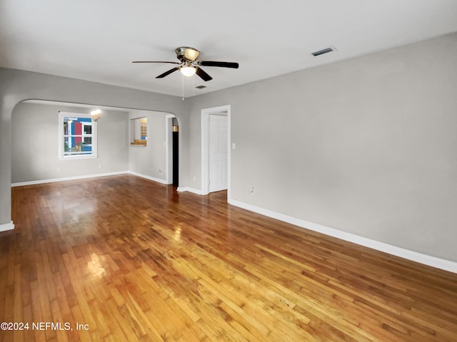 unfurnished living room featuring light hardwood / wood-style floors and ceiling fan