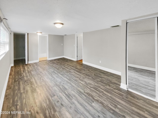 basement featuring dark hardwood / wood-style floors