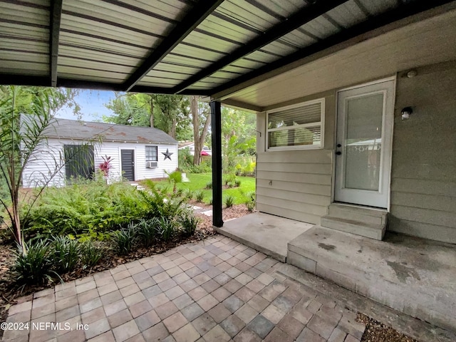 view of patio / terrace featuring an outbuilding