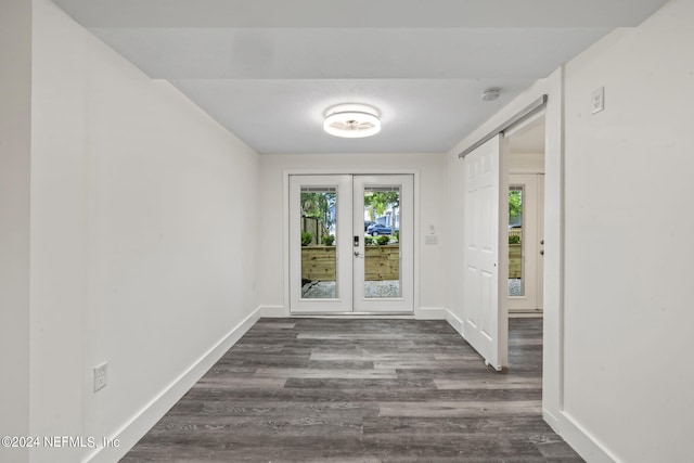 entryway with french doors, dark wood finished floors, and baseboards