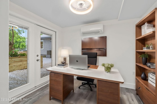 office with dark wood-style floors, french doors, a wall mounted air conditioner, and baseboards