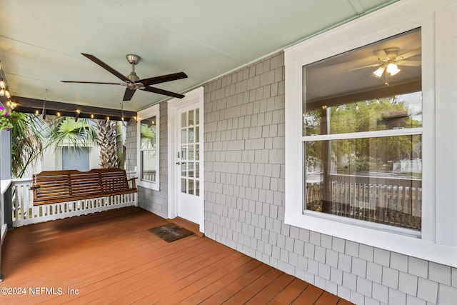 deck featuring a porch and ceiling fan