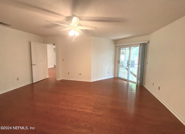 unfurnished room featuring ceiling fan, dark hardwood / wood-style flooring, and a textured ceiling