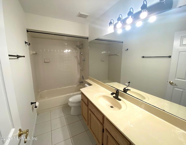 full bathroom with tile patterned floors, vanity, toilet, and tiled shower / bath