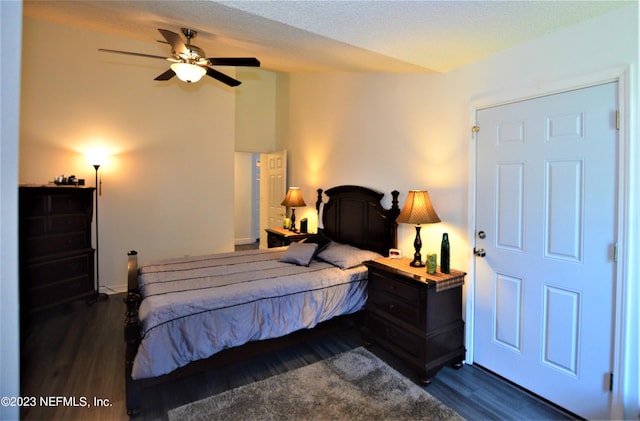 bedroom featuring ceiling fan and dark wood-type flooring