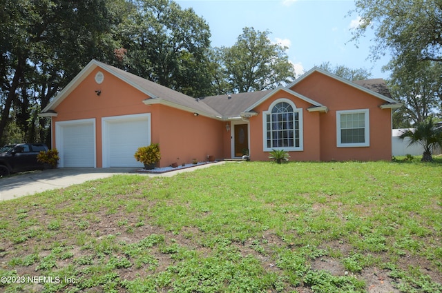 ranch-style home featuring a front yard and a garage