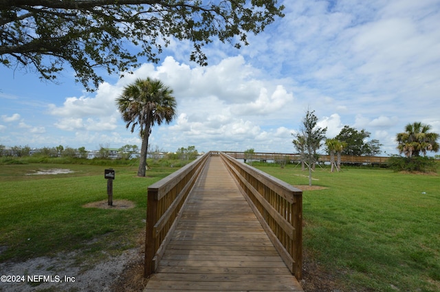 view of home's community featuring a lawn