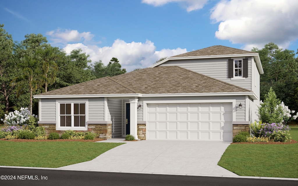 view of front facade with a garage and a front lawn