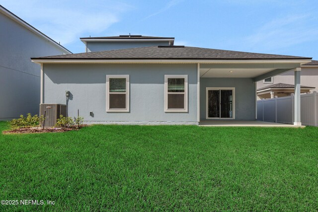 back of house with a yard, central AC unit, and a patio area