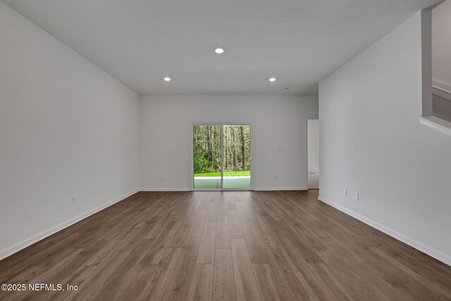 unfurnished room with light hardwood / wood-style floors