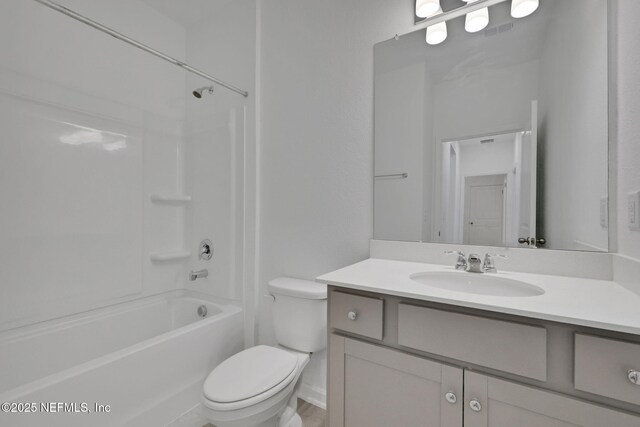 full bathroom featuring vanity, tub / shower combination, and toilet