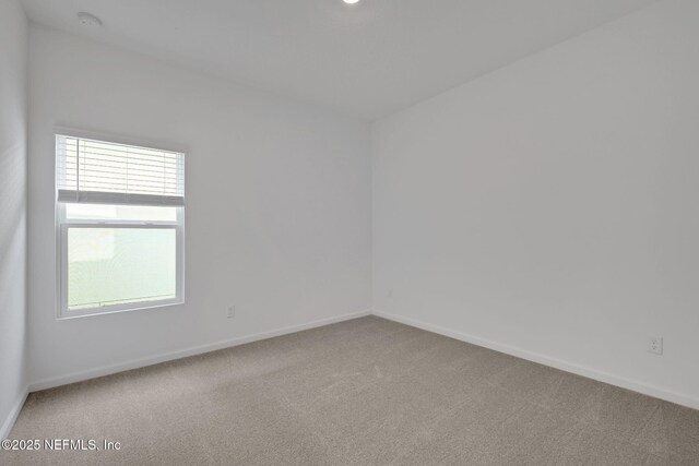 spare room featuring carpet flooring