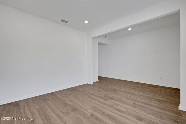 empty room with light hardwood / wood-style floors