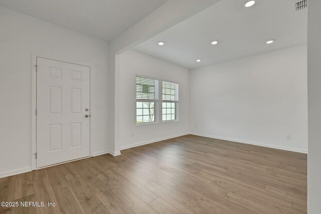 empty room featuring light hardwood / wood-style floors