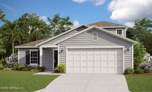 view of front of property with a garage and a front yard