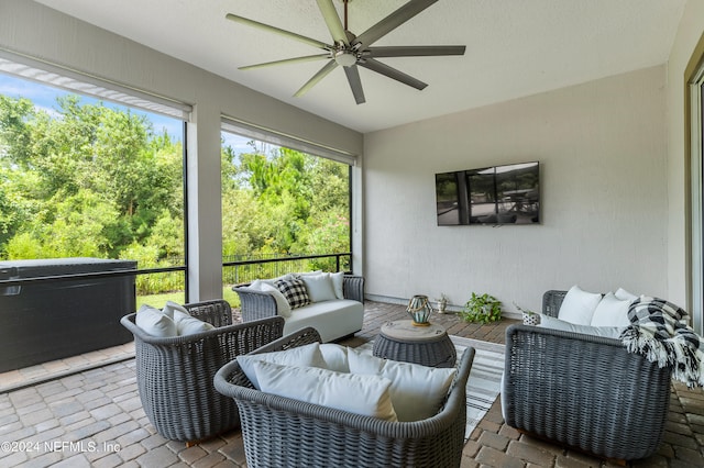 exterior space featuring ceiling fan and an outdoor hangout area